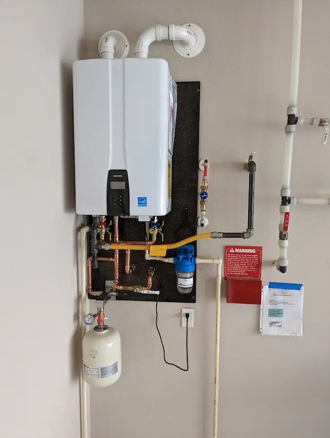 Professional plumber installing copper piping in a Weatherford home